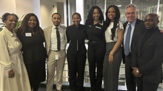 group of black people with one white man on the right