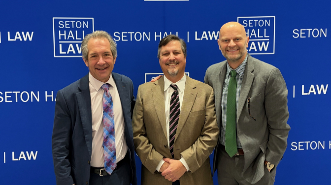 Three white men standing together smiling