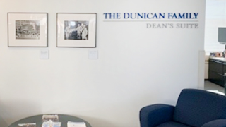 Furniture in front of a wall with text