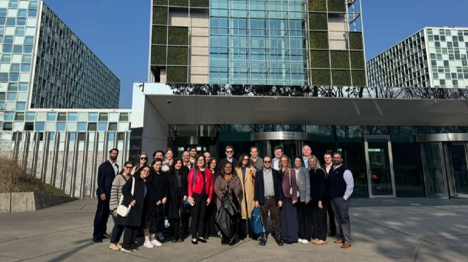 A group of people standing in front of buildings