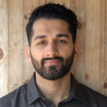 A bearded man with dark hair