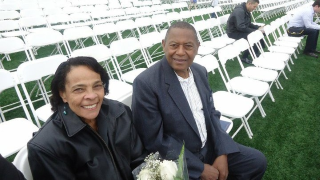 Two elderly people seated together