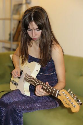 woman playing guitar