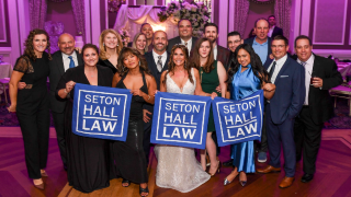 A woman wearing wedding dress in the group center