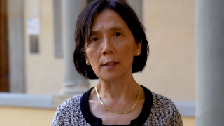 Asian woman with bob hairdo speaking 