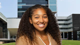 Black woman with long hair smiling