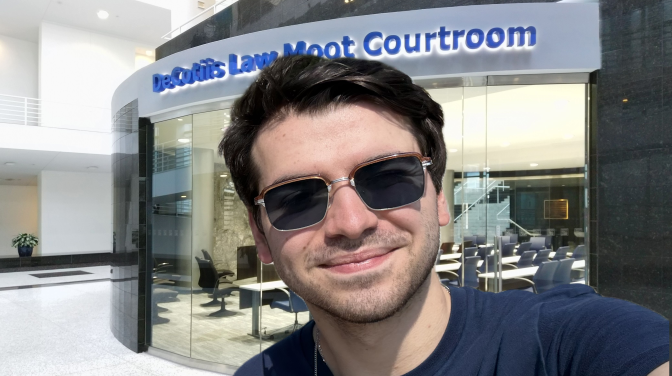 white man wearing sunglasses in courtroom