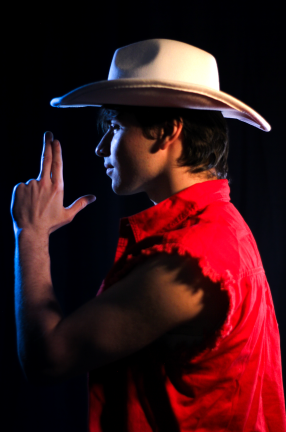 man wearing cowboy hat and red shirt