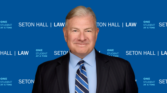old white man smiling before step and repeat
