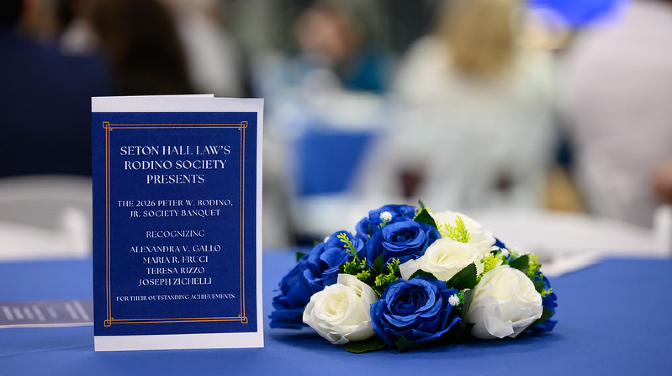 Menu next to blue flowers on a table