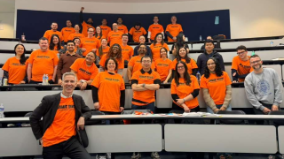 group wearing orange shirts
