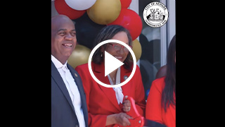 Mayor and woman cutting ribbon