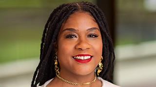 black woman wearing lipstick and jewelry 