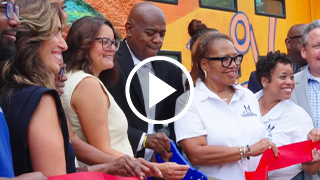 Mayor cutting ribbon with others