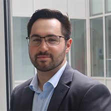 Man with glasses smiling
