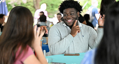 Students having fun talking at an event.