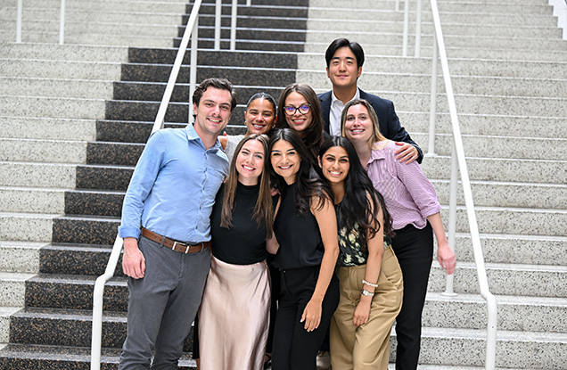 students standing and smiling together