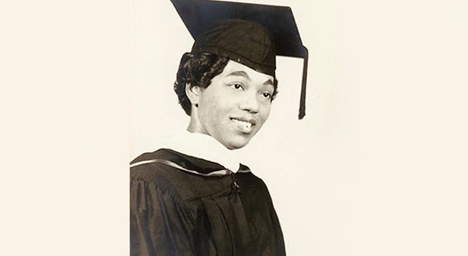 A black and white ohoto of a female graduate