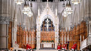 Dressed in  the red vestments symbolic of the Red Mass, priests concelebrate in the Cathedral in Newark.