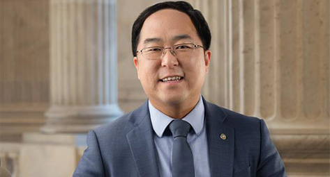 Asian man smiling in photo