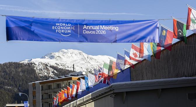 Blue Banner held up high, surrounded by several countries' flags Blue Banner held up high, surrounded by several countries' flags